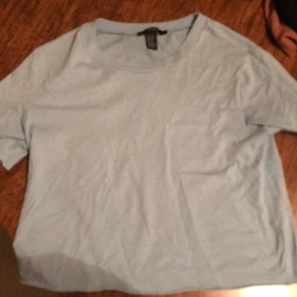 Light blue women’s crop top, short sleeve.